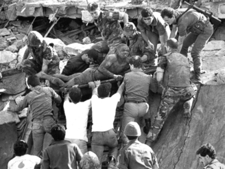 British soldiers assist in rescue operations at the site of the bomb-wrecked US Marine command center near the Beirut airport in Lebanon in 1983. A bomb-laden truck drove into the center collapsing the entire four story building.